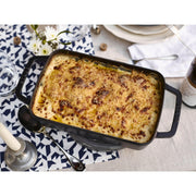 Staub Cast-Iron Rectangular Roasting Pan, 10 x 15, features enameled finish, ideal for browning, braising, roasting. Suitable for all heat sources, dishwasher safe.