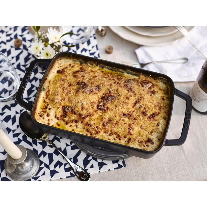 Staub Cast-Iron Rectangular Roasting Pan, 10 x 15, features enameled finish, ideal for browning, braising, roasting. Suitable for all heat sources, dishwasher safe.