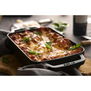 Staub | Cast-Iron Rectangular Roasting Pan, 10 x 15, features a sleek design with enameled cast iron, ideal for browning and roasting on all heat sources.