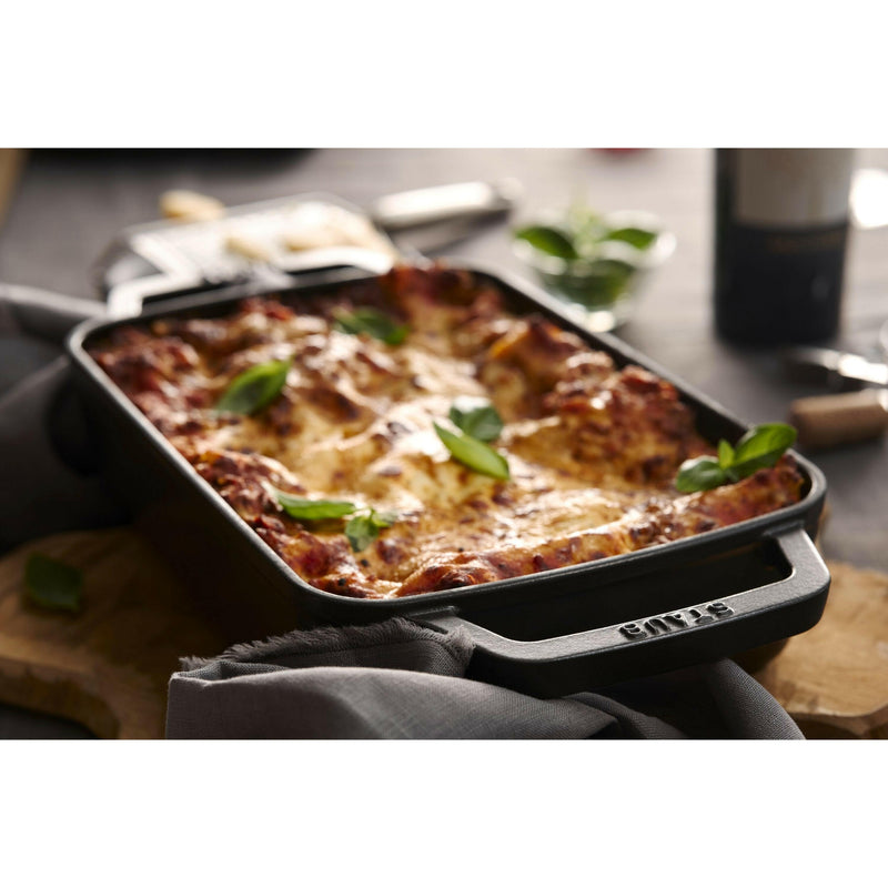 Staub | Cast-Iron Rectangular Roasting Pan, 10 x 15, features a sleek design with enameled cast iron, ideal for browning and roasting on all heat sources.