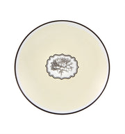 Vista Alegre | Lacroix - Herbariae Set 4 Dessert Plates: Cream-glazed round plates with dark rim, featuring a central botanical illustration inspired by poppy, narcissus, lotus, dahlia, and thistle.