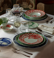 Vista Alegre | The Meaning XL Plate showcased in a formal dining setting with decorative motifs, complemented by elegant glassware and polished silverware, at Athens Cooks.