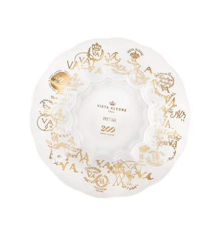 Vista Alegre | 200 Anos Bread and Butter Plate features scallop-edged porcelain with gold emblems and “VA” monograms, celebrating 250 years of Portuguese craftsmanship.