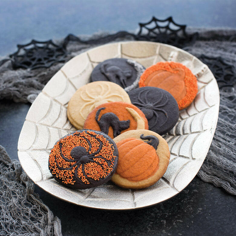 Nordic Ware Halloween Cookie Stamps - Cat with orange handles, featuring spider, pumpkin, and cat designs for festive baking imprints.