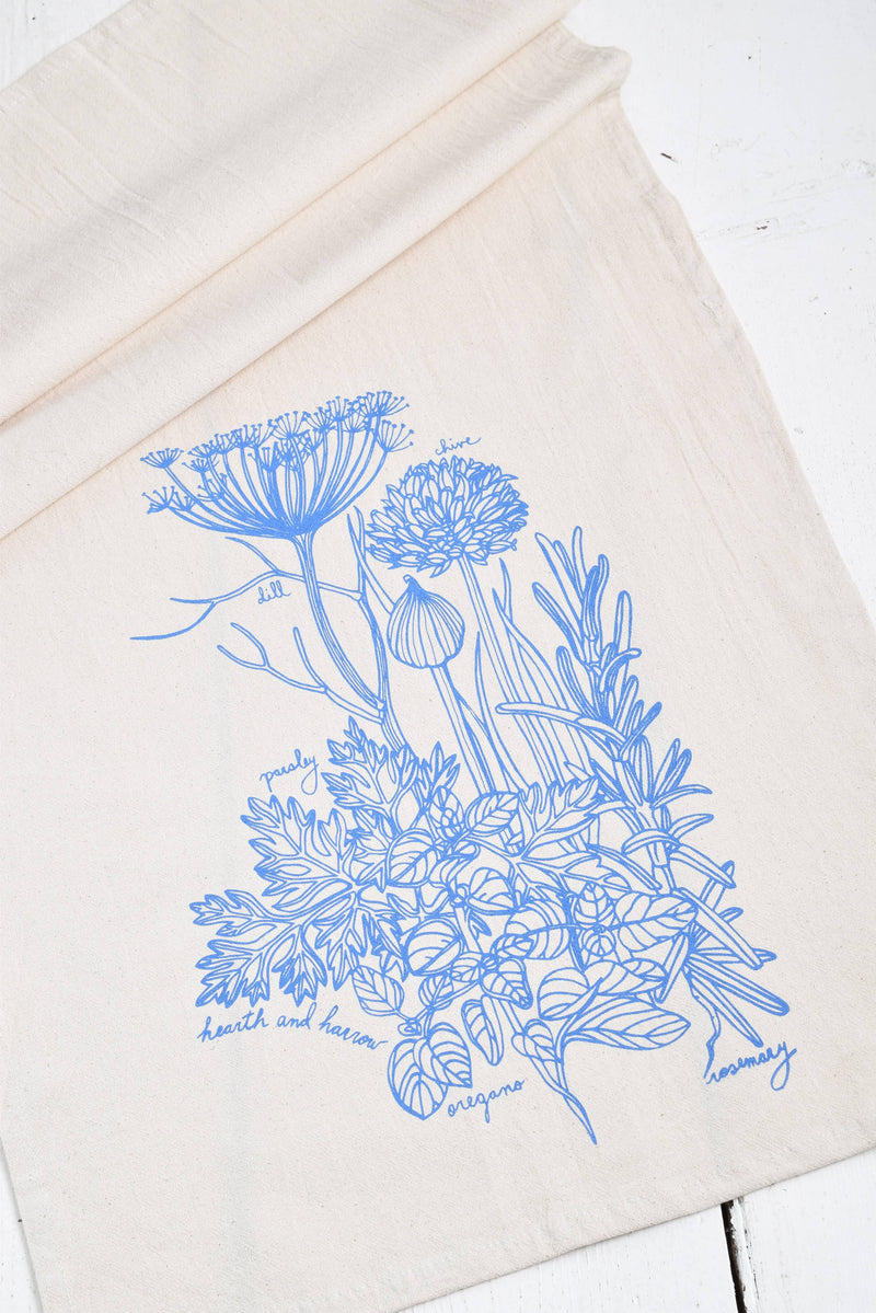 Hearth and Harrow - Kitchen Herbs Tea Towel in Blue-violet, featuring a detailed plant print on organic cotton, ideal for kitchen and dining use.
