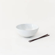 Sarah Kersten - Ramen Bowl: Pacific White, accompanied by chopsticks on a white surface, ideal for versatile culinary uses, including noodles and salads.