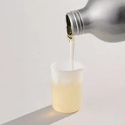 Dirty Labs Reusable Silicone Measuring Beaker — laundry detergent poured into beaker, detergent not included