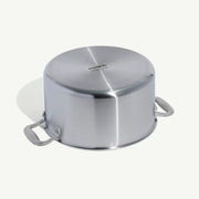 8QT Made In Stainless Steel Stock Pot, viewed upside down, shows base with “Made in Italy” imprint and side handles, highlighting its durable, efficient design.