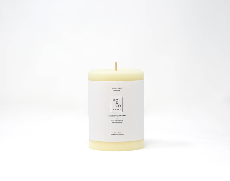 Mo&Co Home - 100% Beeswax Pillar Candle, Natural White, 3x4 Inch, featuring a white label, ideal for eco-friendly home decor and celebrations.