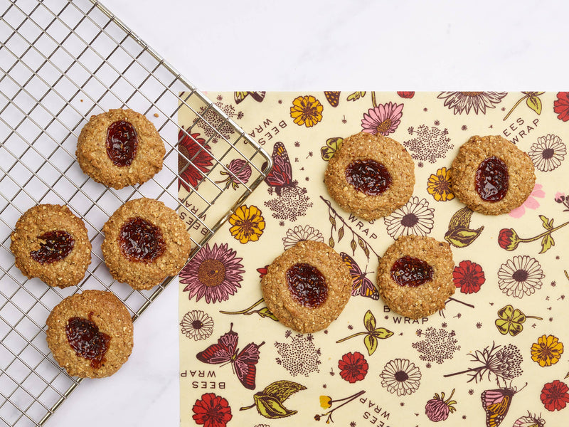Bee's Wrap - Bread Wrap - Meadow Magic, Plant Based Wax, showcasing nut-based cookies with jam on beeswax wrap, highlighting sustainable kitchen solutions from Athens Cooks.