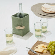UASHMAMA Ice-Cube Beverage Chiller wraps around wine bottles, featuring removable ice packs for chilling, showcased alongside tableware elements like a knife, grapes, and a glass bottle.