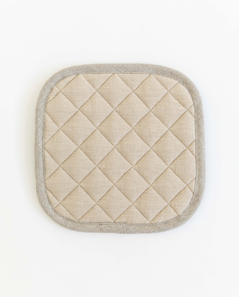 MagicLinen linen pot-holder with quilted detailing and heat insulation, close-up. Ideal kitchen accessory from Athens Cooks, showcasing texture and craftsmanship.