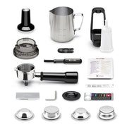 Breville | Barista Touch accessory kit including tamper, milk pitcher, cleaning tools, dosing funnel, portafilter, descaler, and filter baskets for comprehensive espresso machine maintenance.