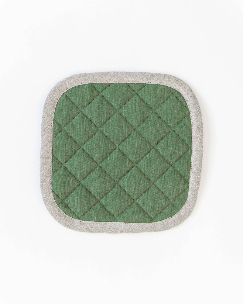 MagicLinen - Linen pot-holder featuring green and white quilted design, square-shaped with a hanging loop, ideal for heat protection while cooking.