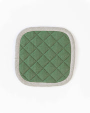 MagicLinen linen pot-holder, square-shaped with green and white pattern, quilted texture, heat-insulating padding, finished with a hanging loop, perfect for kitchen use.