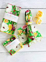 Dot and Army - Terrace Garden Cloth Napkins, set of four: Dinner, featuring vibrant floral prints with matching cocktail napkins and marbled napkin rings on a whitewashed tabletop.