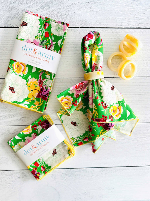 Dot and Army - Terrace Garden Cloth Napkins, set of four: Dinner, featuring vibrant floral prints with matching cocktail napkins and marbled napkin rings on a whitewashed tabletop.