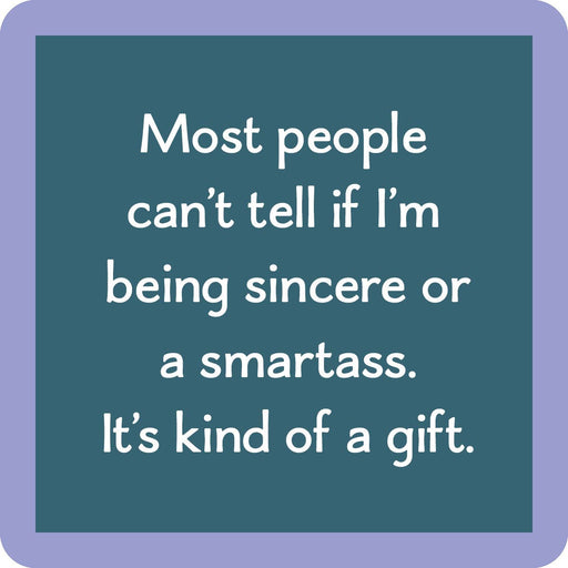 Teal-blue coaster with the phrase “Most people can’t tell if I’m being sincere or a smartass. It’s kind of a gift.” from Drinks on Me.