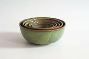 RachaelPots | Set of Three Nesting Bowls - Robin's Egg Blue, hand-thrown ceramic bowls with green glaze and brown rims, neatly nested on a white surface.