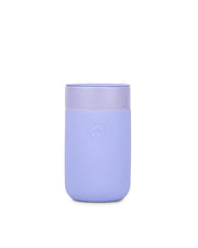 W&P - Reusable Ceramic Mug: Terrazzo Blush, 16 oz, purple container with lid, features a splash-resistant lid and soft-touch silicone sleeve for easy sipping.