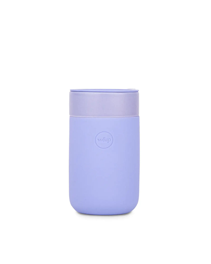 W&P - Reusable Ceramic Mug: Terrazzo Blush, 16 oz, purple container with lid, features a splash-resistant lid and soft-touch silicone sleeve for easy sipping.