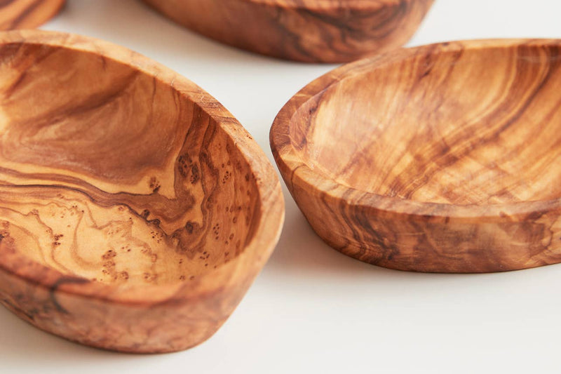 Set of four Verve Culture Italian Olivewood Aperitivo Bowls, showcasing hand-carved, rich wood-grain patterns, perfect for serving appetizers, crafted by artisans in Umbria, Italy.
