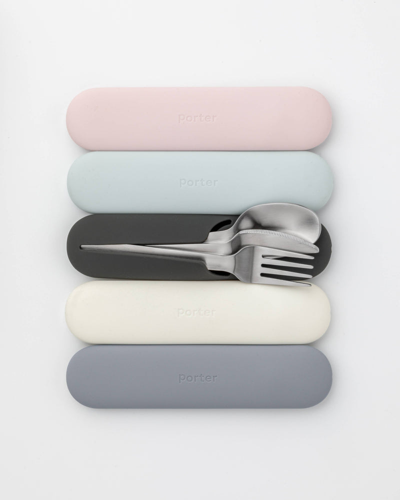 W&P - Stainless Steel Utensils Set in Silicone Carry Case: Terrazzo Charcoal, featuring a fork, spoon, and knife neatly stored in a compact case.