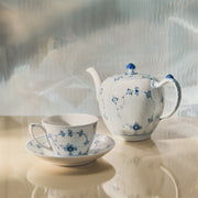 Royal Copenhagen | Blue Fluted Plain Cup & Saucer 28cl featuring a classic blue floral pattern, reflecting elegance and tradition, perfectly suitable for a refined tea experience.