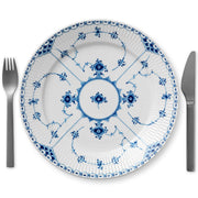 Royal Copenhagen | Blue Fluted Hl Plate, 27cm, features a delicate blue floral design with a fork and knife elegantly placed beside it.