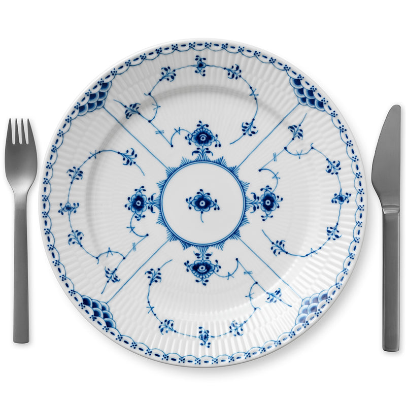 Royal Copenhagen | Blue Fluted Hl Plate, 27cm, features a delicate blue floral design with a fork and knife elegantly placed beside it.