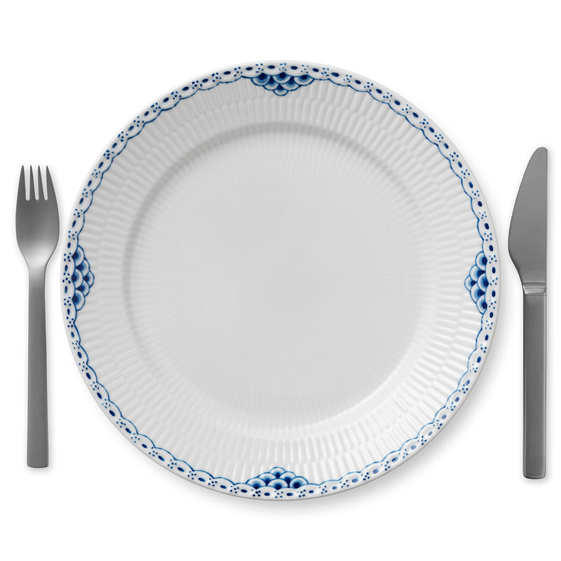 Royal Copenhagen | Princess Plate, 27cm, features a hand-painted blue scalloped rim, paired with stainless-steel cutlery, ideal for elegant dining settings.