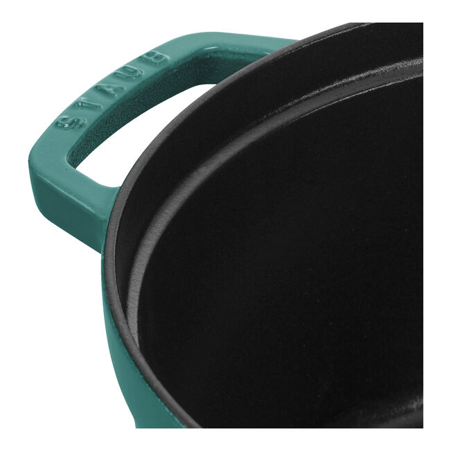 Close-up of STAUB 4 qt Round Cocotte's rim and handle, showcasing the brand's craftsmanship, ideal for slow-cooking and serving, embodying Athens Cooks' curated kitchen excellence.