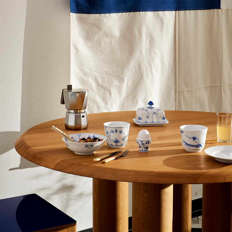 Royal Copenhagen | Blue Fluted Plain Butter Dish elegantly set on a breakfast table with matching porcelain, enhancing a curated dining experience.