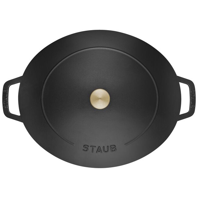 Staub Wide Oval Dutch Oven in Graphite Grey, featuring generous oval design for optimal cooking surface, ideal for braising and baking, with self-basting lid for moisture retention.