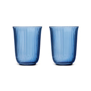Royal Copenhagen | Waves Highball Glass, Blue, Set of 2: Two elegant, blue-tinted tumblers with fluted ridges, perfect for cocktails and summer drinks.