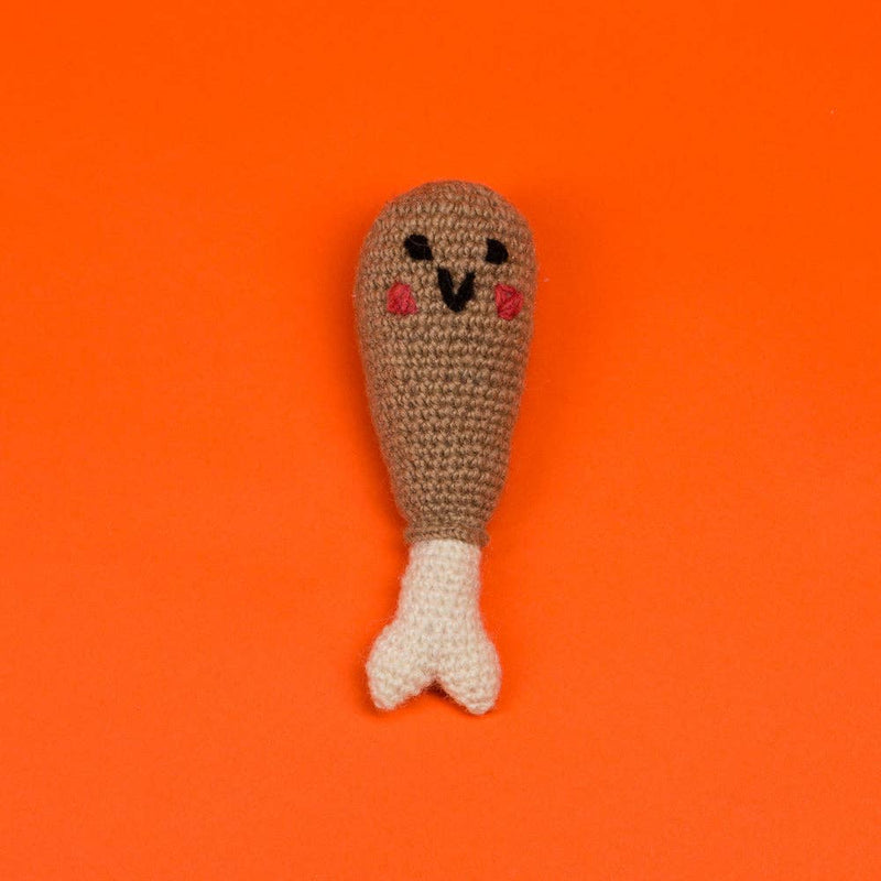 Ware of the Dog - Hand Knit Drumstick Dog Toy, a fair-trade amigurumi crochet toy with a kawaii face, crafted from 100% lambswool by Nepalese artisans.