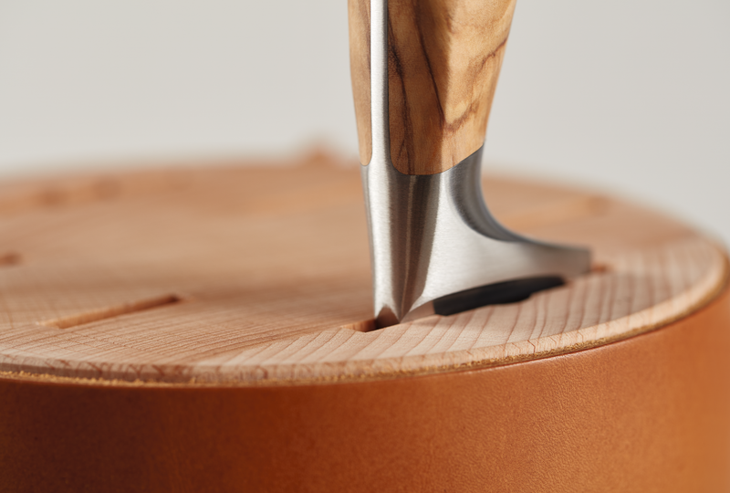 Close-up of Wüsthof 6-Slot Block, Beech with Leather, showcasing detailed wood grain and slots for knife storage, ideal for enhancing kitchen organization.
