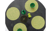 Chilewich | Mini Basketweave Round Placemats - Coast on a table with bowls and a green spoon, showcasing its refined two-over-two yarn design.