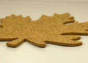 Graf Lantz | Merino Wool Autumn Leaf Trivet - Ochre on display, showcasing its protective, heat-resistant qualities on a white surface.