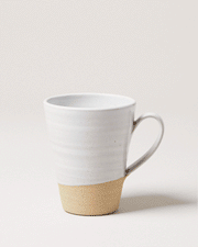 Farmhouse Pottery - Tall Silo Mug: Single, handcrafted ceramic mug with a white glazed top and natural stoneware base, featuring a flared lip and loop handle.