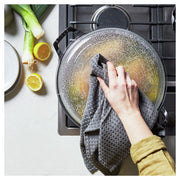 Staub 12-inch Cast Iron Braiser with Glass Lid, ideal for one-pot meals, features a moisture-locking domed lid and durable enameled cast iron construction.