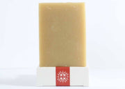 Little Seed Farm Orange Vetiver Bar Soap, featuring organic Sweet Orange and Vetiver oils, offers a soothing, citrusy aroma for a calming bath experience.