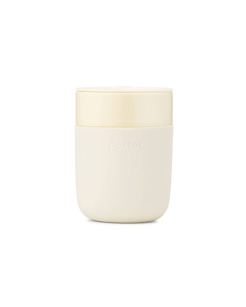 Reusable ceramic mug with splash-resistant lid, featuring a matte silicone sleeve for a non-slip grip, 16 oz capacity.