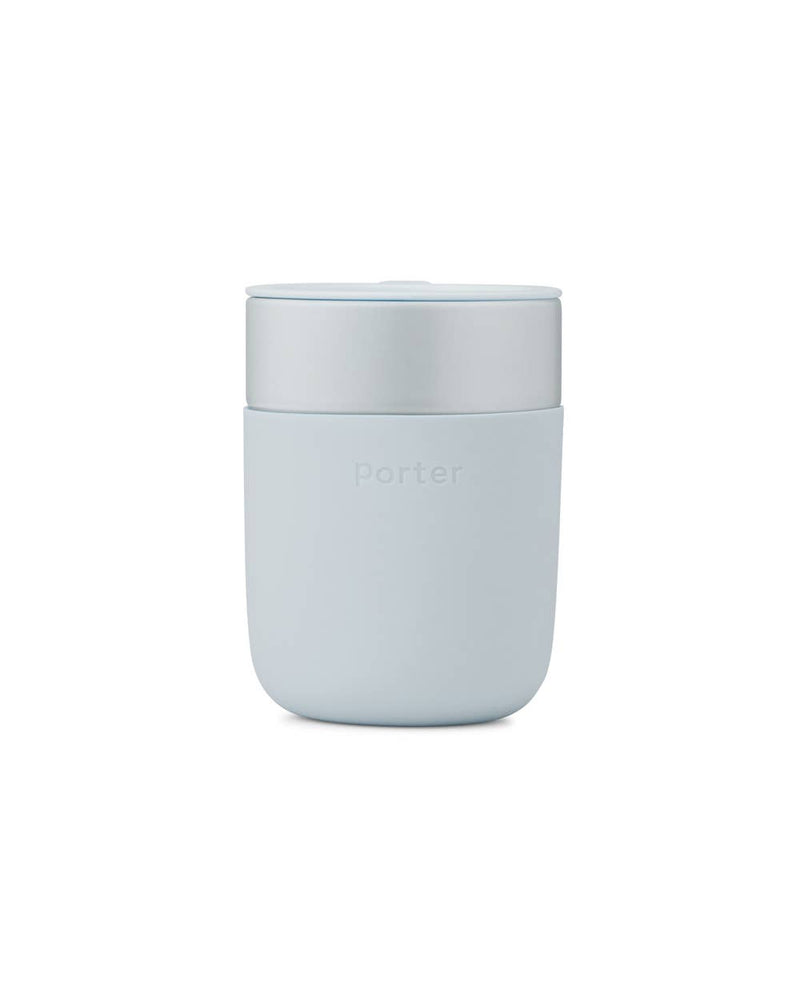W&P - Reusable Ceramic Mug: Terrazzo Blush / 16 oz, shown with a lid and soft-touch silicone sleeve for easy grip, ideal for eco-friendly beverage enjoyment.