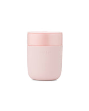 W&P - Reusable Ceramic Mug: Terrazzo Blush / 16 oz, featuring a pink container with a splash-resistant lid for easy sipping and a silicone sleeve for grip.