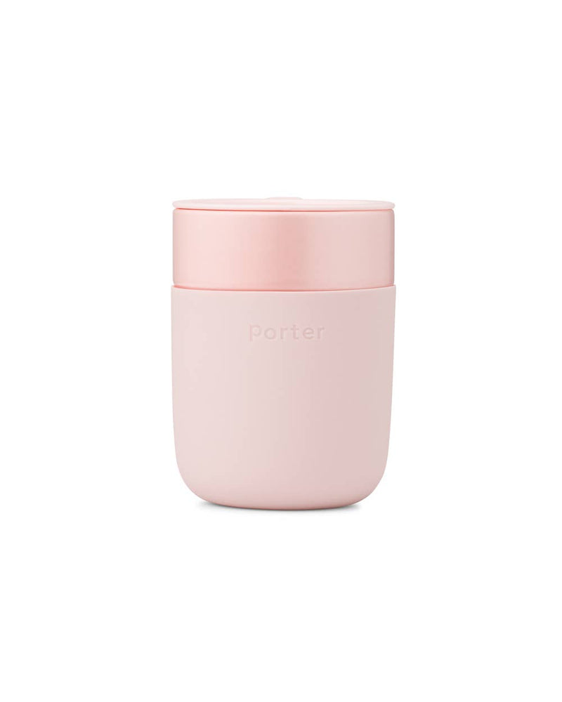 W&P - Reusable Ceramic Mug: Terrazzo Blush / 16 oz, featuring a pink container with a splash-resistant lid for easy sipping and a silicone sleeve for grip.