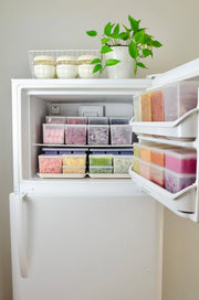 W&P - Freezer Cube Storage Containers: Set of 3 - Small/Medium/Large neatly stacked in a refrigerator, showcasing organized food storage with transparent, labeled lids.