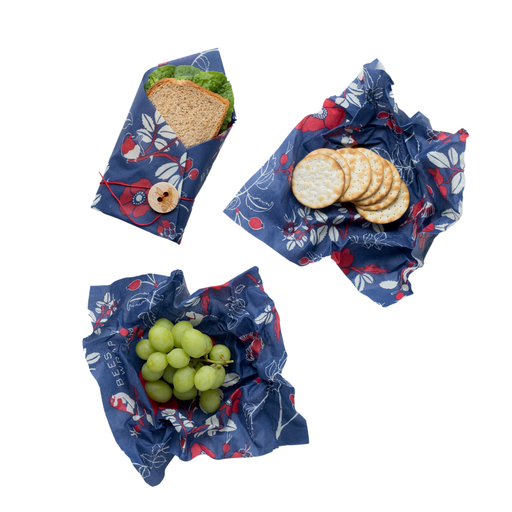 Bee's Wrap - Lunch 3 Pack - Botanical: eco-friendly wraps with floral patterns, holding a sandwich, crackers, and grapes, promoting sustainable lunch storage from Athens Cooks.