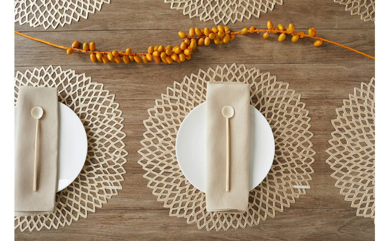 Chilewich | Dahlia Placemats - Brass, elegantly designed with open lace cutwork, enhancing table settings by acting as a sophisticated charger for plates.