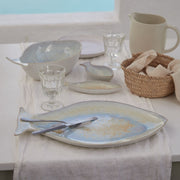 Casafina Large Mackarel Serving Platter on a table with plates, utensils, and a clear water glass, ideal for elegant dining.